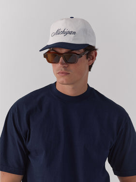 hat with michigan in cursive font at front one dna